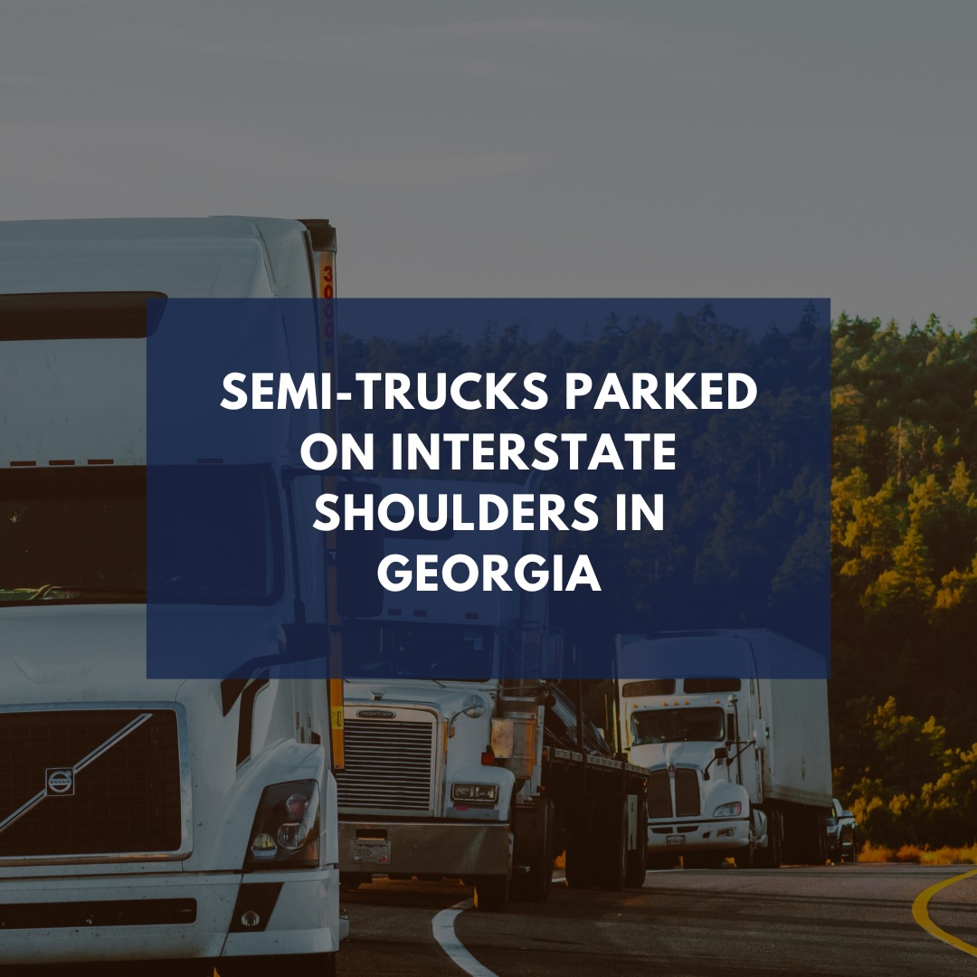 Semi-trucks parked on shoulder of road