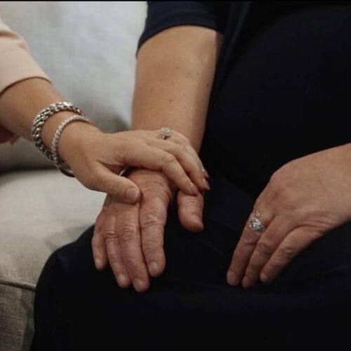 Macon wrongful death lawyer Ashley Brodie holding a client's hand